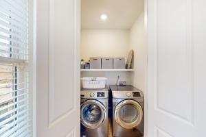 a small laundry room with a washer and dryer at Oakley Hollow in Nashville