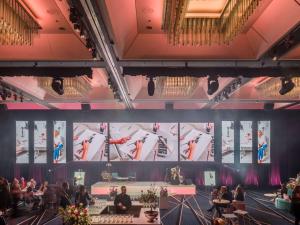 a group of people sitting at tables in a room at Sofitel Brisbane Central in Brisbane