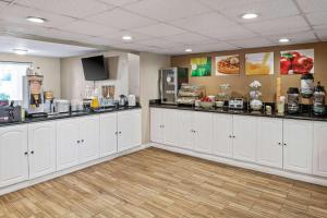 a large room with white cabinets and a counter at Quality Inn Kingsland in Kingsland