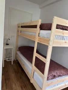 a couple of bunk beds in a room at Lakeside Apartments in Egilsstaðir
