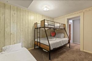 a bedroom with two bunk beds in it at 6bedrooms, ramp boat dock slips water toys, nice cove area in Linn Creek