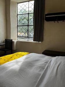 Letto o letti in una camera di Hotel Maculís
