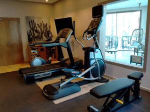 a gym with a treadmill and two chairs and a window at Dakhla South Bay in Dakhla