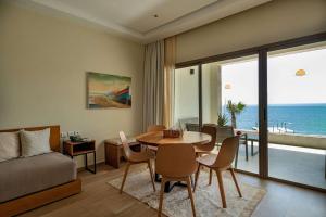 a living room with a table and chairs and a couch at Dakhla South Bay in Dakhla