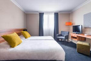 Postel nebo postele na pokoji v ubytování Best Western Hotel Atrium Valence