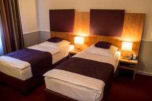 Ένα ή περισσότερα κρεβάτια σε δωμάτιο στο Hotel Niederrad - Self Check In