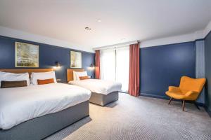 Postel nebo postele na pokoji v ubytování Ropewalks Hotel