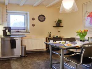 a kitchen with a table and chairs in a room at Holiday home on the Lay in Traben-Trarbach