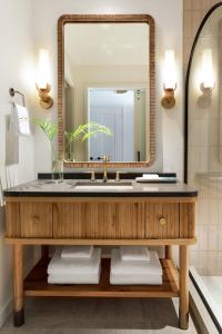 a bathroom with a sink and a mirror at Hotel Indigo Grand Cayman, an IHG Hotel in Grand Cayman