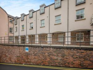 a row of buildings on a brick wall at Moonlight Apartment - Uk46023 in Durham