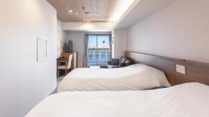 kisarazu bay Town Hotel客房内的一张或多张床位