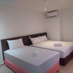 Postel nebo postele na pokoji v ubytování One Dream Hotel