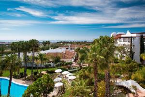 an aerial view of a resort with a pool and palm trees at The Westin La Quinta Golf Resort & Spa, Benahavis, Marbella in Marbella
