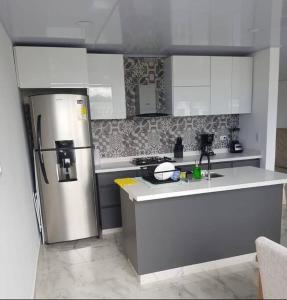 Kuchyň nebo kuchyňský kout v ubytování Apartamento Tiziano Resort