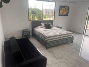 Postel nebo postele na pokoji v ubytování Apartamento Tiziano Resort