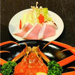 two plates of food with a lobster on a table at Hakuba Alps Hotel in Otari