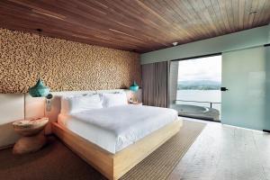 Letto o letti in una camera di The Brown, Guatape, Autograph Collection