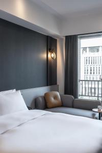 Postel nebo postele na pokoji v ubytování Hotel Euphemia