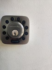 a remote control attached to a white wall at casa independiente por días en Punta Arenas in Punta Arenas +9 photos