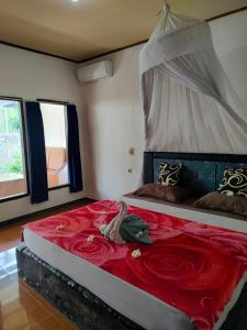 Postel nebo postele na pokoji v ubytování Aladdin Homestay