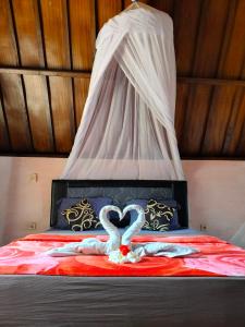 Postel nebo postele na pokoji v ubytování Aladdin Homestay