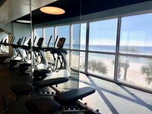 a gym with a view of the beach and the ocean at Panama City Beach Ocreanfront 2BR in Splash Resort 402W in Panama City Beach