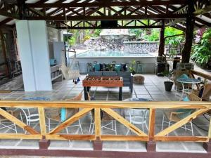 a living room with a table and a couch at Tiny House in La Fortuna with Jacuzzi and Pool in Fortuna