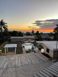 an aerial view of a parking lot at sunset at Lomeli’s Home, 5 minutos del Tunco in La Libertad
