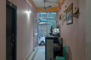 a hallway with a room with a car in it at Goroomgo Shree Bhumi Puri Near Sea Beach - Best Hotel in Puri in Puri