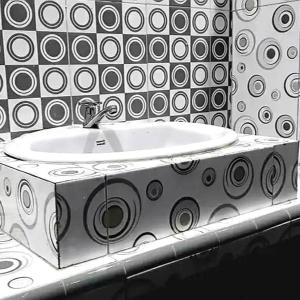 ein weißes Waschbecken in einem schwarz-weißen Badezimmer in der Unterkunft Sky View Bromo Guest House in Ngadisari