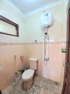 Koupelna v ubytování Homestay Jogja Condongcatur by Simply Homy