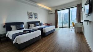 Postel nebo postele na pokoji v ubytování The Penthouse and Suite SGR Melaka