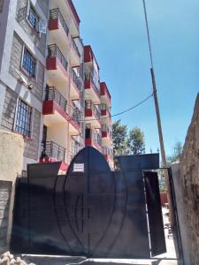 a building with a slide in front of a building at Muthiga Springs Apartment in Kikuyu