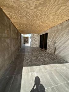 a shadow of a person standing under a ceiling at Casa cómoda, grande y agradable. in Arica
