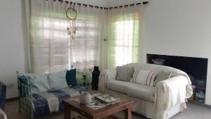 a living room with a couch and a coffee table at Los Abuelos in Duggan +34 photos
