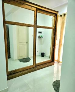 a large glass window in a room with a door at Villa 005 in Kirillapone