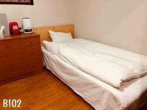 Postel nebo postele na pokoji v ubytování 冠京ホテル