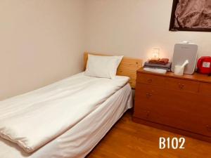 Postel nebo postele na pokoji v ubytování 冠京ホテル