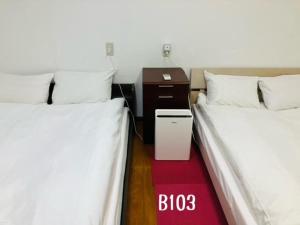 Postel nebo postele na pokoji v ubytování 冠京ホテル
