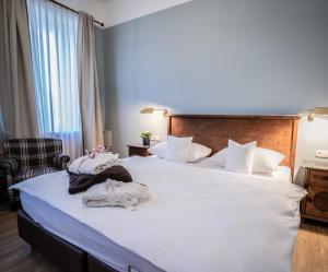 Postel nebo postele na pokoji v ubytování Alpenstadthotels