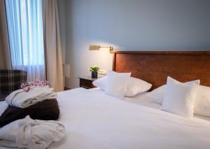 Postel nebo postele na pokoji v ubytování Alpenstadthotels