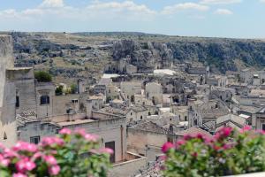 
a cityscape of a city with buildings and mountains at Casa Diva in Matera
