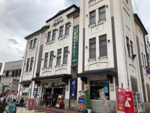 a building on the corner of a city street at Sungarden - Vacation STAY 95967 in Otaru