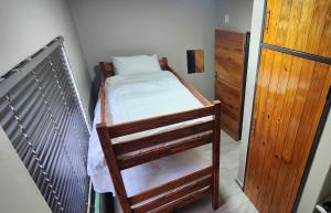 a small bedroom with a bunk bed in a room at The View on Vaal Resort in Sasolburg