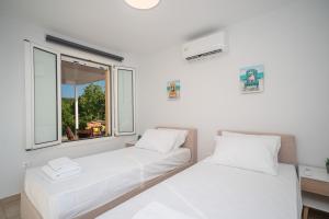 Кровать или кровати в номере Villa Marilou