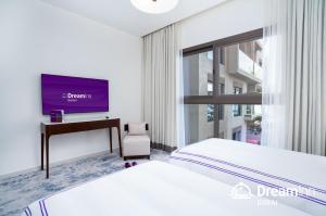 Llit o llits en una habitació de Dream Inn - Address Beach Residence - Free Beach Access