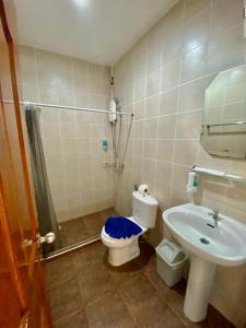 a bathroom with a toilet and a sink at BT hotel Kata Beach in Kata Beach