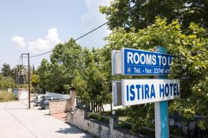 a street sign for arosos tofu istg at Istira in Possidi