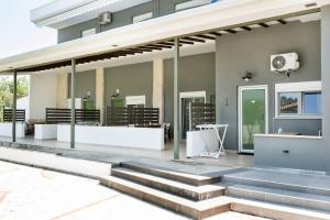 a building with stairs in front of it at Istira in Possidi