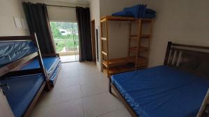 Cama ou camas em um quarto em Casa na Praia do Sapê - Piscina - Churrasqueira mais 18 fotos